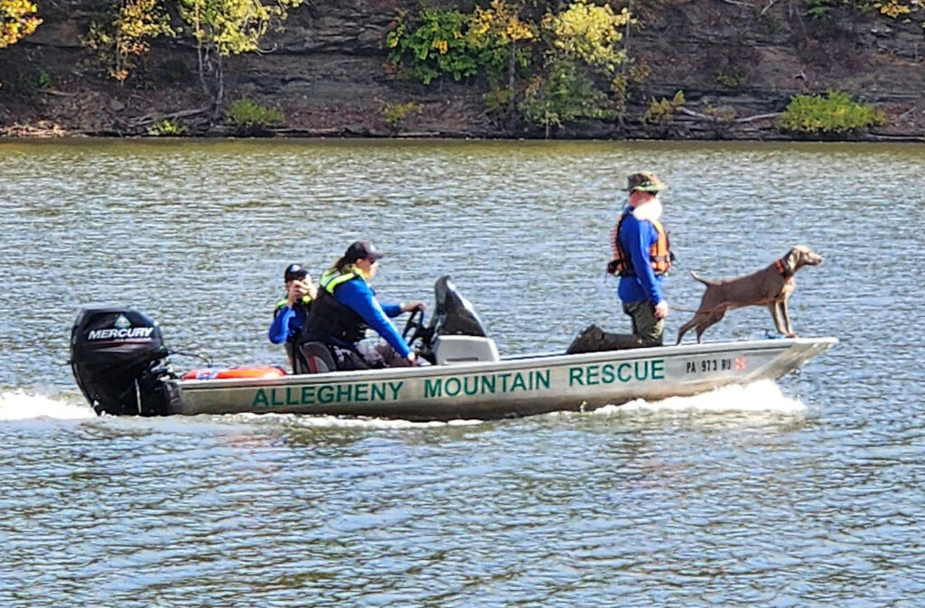 AMRG's boat with a K9 working onboard